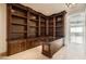 Office space with built-in bookshelves, a desk area, and stunning views from the balcony at 9101 Alta Dr # 1203, Las Vegas, NV 89145