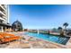 Resort-style rooftop pool with lounge chairs, decorative statues, and city views in the background at 9101 Alta Dr # 1203, Las Vegas, NV 89145