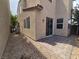 Backyard featuring a brick patio and low maintenance landscaping, perfect for outdoor relaxation at 9312 Gold Dove Ct, Las Vegas, NV 89178