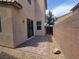 Backyard featuring a brick patio and low maintenance landscaping, perfect for outdoor enjoyment and privacy at 9312 Gold Dove Ct, Las Vegas, NV 89178