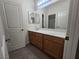 Bathroom vanity with cabinets, mirror, and lighting at 9312 Gold Dove Ct, Las Vegas, NV 89178