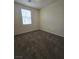 A bright bedroom with plush carpet and a large window, offering comfort and natural light at 9312 Gold Dove Ct, Las Vegas, NV 89178