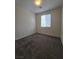 A cozy bedroom with soft carpet and a window, creating a serene and inviting space at 9312 Gold Dove Ct, Las Vegas, NV 89178