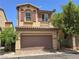 Charming two-story home with a two-car garage and desert landscaping in a sunny neighborhood at 9312 Gold Dove Ct, Las Vegas, NV 89178