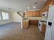 Open floor plan showing eat-in kitchen and the living room with a ceiling fan at 9312 Gold Dove Ct, Las Vegas, NV 89178