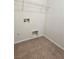 Compact laundry area with tiled floor, wire shelving, and water hookups ready for appliances at 9312 Gold Dove Ct, Las Vegas, NV 89178