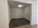 Open living room featuring neutral walls, carpet, and an open doorway to a tile floored room at 9312 Gold Dove Ct, Las Vegas, NV 89178