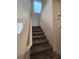 Carpeted staircase leading to the upper level at 9312 Gold Dove Ct, Las Vegas, NV 89178