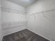 A walk-in closet equipped with wire shelving, maximizing storage space and organization at 9312 Gold Dove Ct, Las Vegas, NV 89178