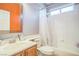 Bright bathroom showcasing a bathtub-shower combination with vanity and neutral color scheme at 10373 Hawk Ravine St, Las Vegas, NV 89178