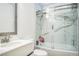 Beautiful bathroom with tiled shower and glass door with marble accents at 10373 Hawk Ravine St, Las Vegas, NV 89178