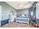 Cozy bedroom with plush carpeting, neutral color scheme, and a comfortable bed at 10373 Hawk Ravine St, Las Vegas, NV 89178