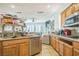 Eat-in kitchen featuring stainless steel appliances, granite countertops, and eat-in kitchen at 10373 Hawk Ravine St, Las Vegas, NV 89178