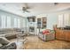 Spacious living room showcasing tile flooring and ample natural light at 10373 Hawk Ravine St, Las Vegas, NV 89178