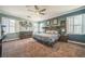 Spacious main bedroom with carpet flooring, plantation shutters, and elegant furnishings at 10373 Hawk Ravine St, Las Vegas, NV 89178