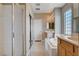 Luxurious bathroom features a shower with glass doors, a tub, and double sinks at 1127 Lake Berryessa St, Henderson, NV 89002