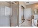 Bathroom with large shower with glass doors, a soaking tub, and a vanity at 1127 Lake Berryessa St, Henderson, NV 89002