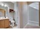 Neutral bathroom featuring wood cabinets and light-colored tile and floors at 1127 Lake Berryessa St, Henderson, NV 89002
