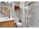 Bathroom featuring a shower with a glass door and white tile at 1127 Lake Berryessa St, Henderson, NV 89002