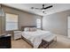 Bedroom with bright natural light from the large windows and a ceiling fan at 1127 Lake Berryessa St, Henderson, NV 89002