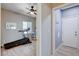 Bedroom view with a ceiling fan and a treadmill placed near a window at 1127 Lake Berryessa St, Henderson, NV 89002
