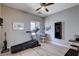 Bedroom view with a ceiling fan and a treadmill placed near a window at 1127 Lake Berryessa St, Henderson, NV 89002