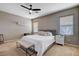 Comfortable bedroom with natural light from windows and a ceiling fan at 1127 Lake Berryessa St, Henderson, NV 89002