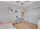 Bright bedroom features a cozy bed, closet, and a play kitchen set for children at 1127 Lake Berryessa St, Henderson, NV 89002