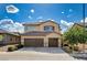 Charming two-story home with three-car garage, tile roof and well-maintained landscaping at 1127 Lake Berryessa St, Henderson, NV 89002