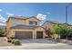 Inviting two-story home boasting a three-car garage, tile roof and easy care landscaping at 1127 Lake Berryessa St, Henderson, NV 89002