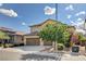 Two-story home featuring a three-car garage and well-manicured landscaping at 1127 Lake Berryessa St, Henderson, NV 89002