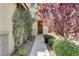 Inviting front entrance featuring mature landscaping and a classic dark front door with wreath at 1127 Lake Berryessa St, Henderson, NV 89002