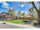 This home boasts a beautiful front yard with lush landscaping, trees, and a manicured lawn at 1127 Lake Berryessa St, Henderson, NV 89002