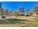 Community playground featuring a slide, climbing wall, and swings with picnic tables and neighborhood homes nearby at 1127 Lake Berryessa St, Henderson, NV 89002