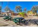 Neighborhood playground with green picnic tables and colorful play equipment in a well-maintained outdoor space at 1127 Lake Berryessa St, Henderson, NV 89002