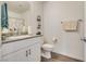 Clean bathroom with a granite counter, white vanity, and a modern faucet at 12110 Midnight Pine Rd # 4, Las Vegas, NV 89183