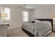 This is a bedroom with neutral walls and soft light and a comfortable bed at 12110 Midnight Pine Rd # 4, Las Vegas, NV 89183