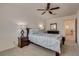 Cozy bedroom with soft carpet, ceiling fan, and ambient lighting at 12110 Midnight Pine Rd # 4, Las Vegas, NV 89183