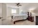 Bedroom features plush carpeting, ceiling fan, and lots of natural light at 12110 Midnight Pine Rd # 4, Las Vegas, NV 89183