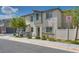 Well-maintained home featuring neutral stucco, a gray accent, and drought-resistant landscaping at 12110 Midnight Pine Rd # 4, Las Vegas, NV 89183