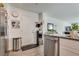 Open kitchen with stainless steel appliances, white cabinets, and sleek countertops at 12110 Midnight Pine Rd # 4, Las Vegas, NV 89183