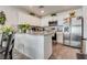 Bright kitchen with stainless steel appliances, white cabinets and granite countertops at 12110 Midnight Pine Rd # 4, Las Vegas, NV 89183
