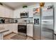 Kitchen with stainless steel appliances, white cabinets, and granite countertops at 12110 Midnight Pine Rd # 4, Las Vegas, NV 89183