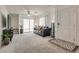 Comfortable living room with a sliding glass door and modern furnishings and decor at 12110 Midnight Pine Rd # 4, Las Vegas, NV 89183