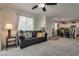 Cozy living room featuring a comfortable couch and an adjacent dining area and kitchen at 12110 Midnight Pine Rd # 4, Las Vegas, NV 89183