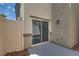 Cozy outdoor patio featuring a sliding door and secure fencing at 12110 Midnight Pine Rd # 4, Las Vegas, NV 89183