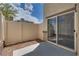 Private patio with sliding glass door and fenced yard at 12110 Midnight Pine Rd # 4, Las Vegas, NV 89183