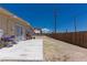 Large backyard with a concrete patio, fencing, and ample open space at 1312 Denarius Cir, Las Vegas, NV 89101