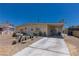 Charming single-story home with a long driveway, mature landscaping, and a well-maintained front yard at 1312 Denarius Cir, Las Vegas, NV 89101