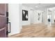 Bright foyer with beautiful hardwood floors, white walls, and modern decor at 1343 Panini Dr, Henderson, NV 89052